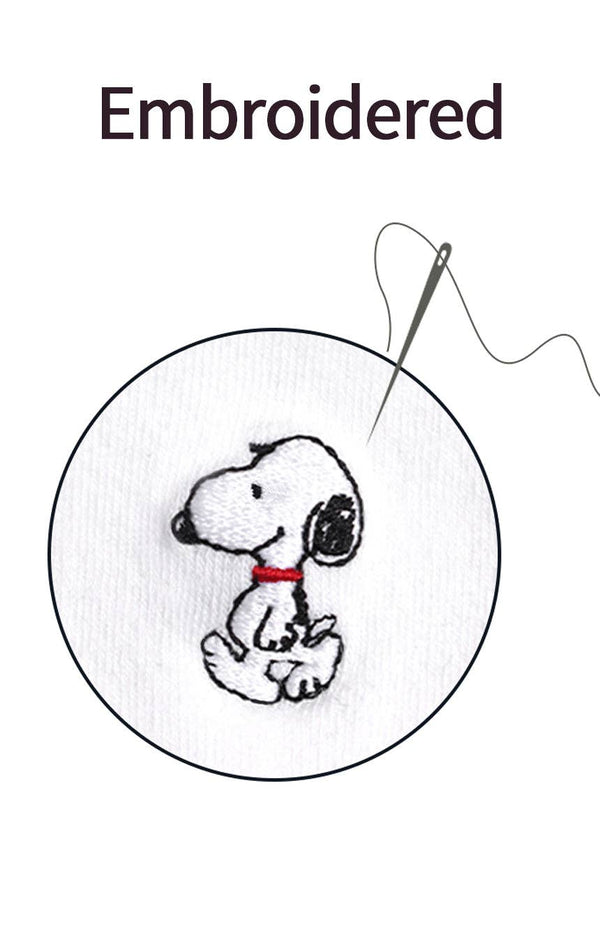 Embroidered design of Snoopy with a needle and thread on a white background