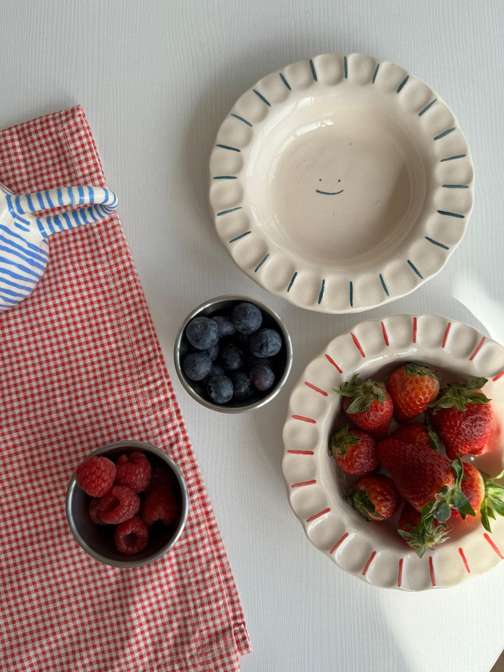 handmade smiley plate by Prop Ceramics