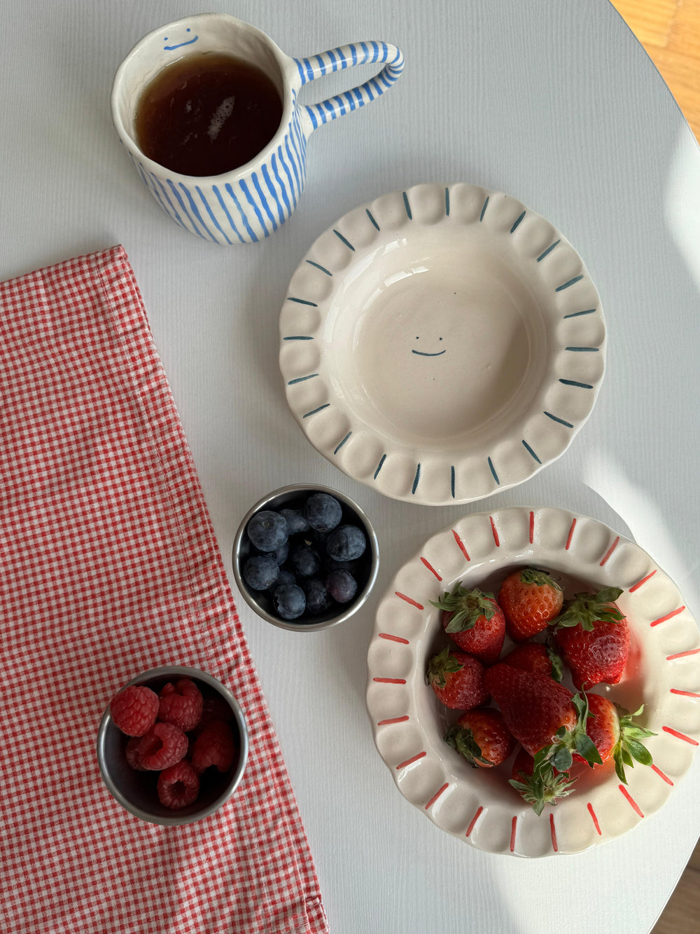 handmade smiley plate by Prop Ceramics