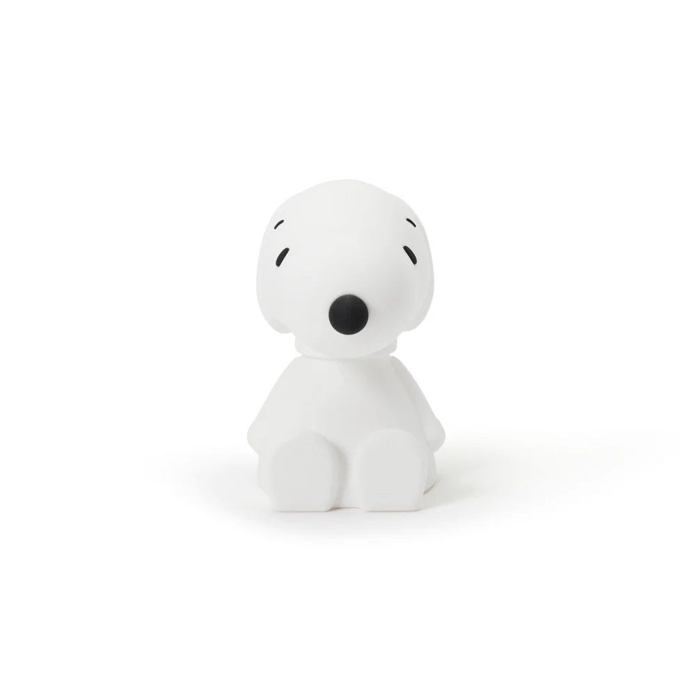White snoopy figurine with black accents on a white background