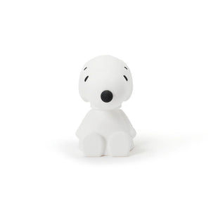 White snoopy figurine with black accents on a white background