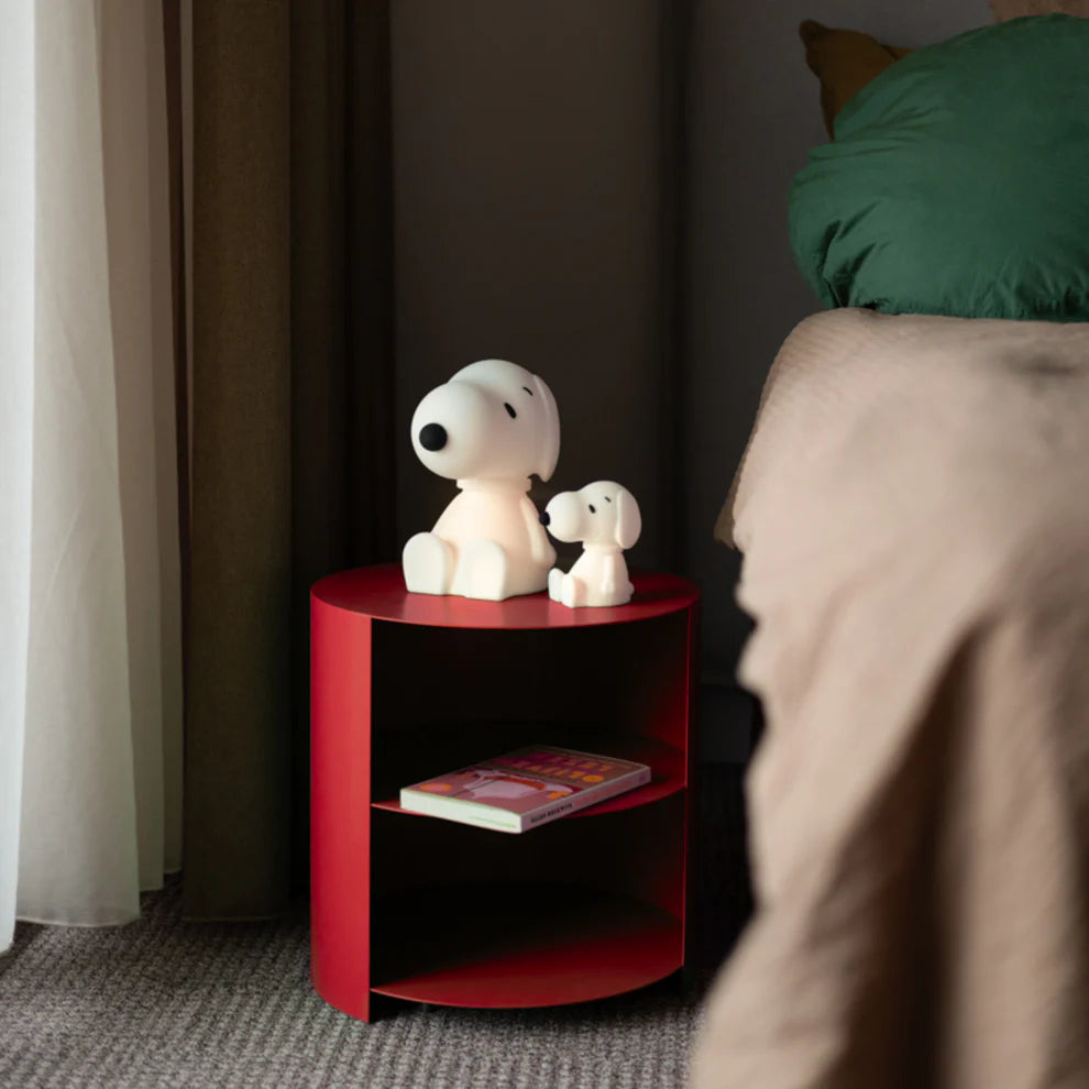 White snoopy figurine with black accents on a white background