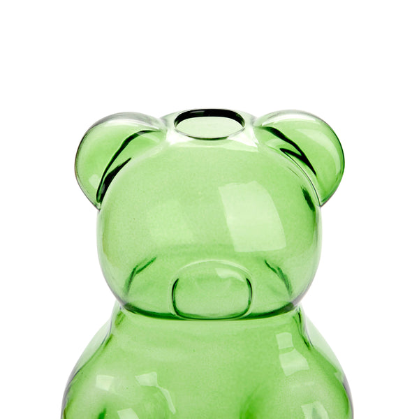 Green glass bear-shaped vase on a white background
