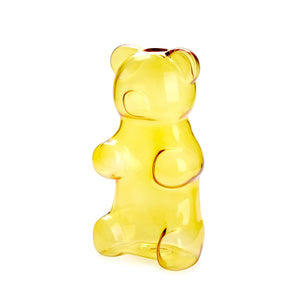 Yellow gummy bear-shaped vase on a white background